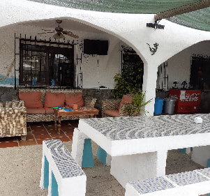 Eat al fresco with the outdoor dining area at Casa Perez.